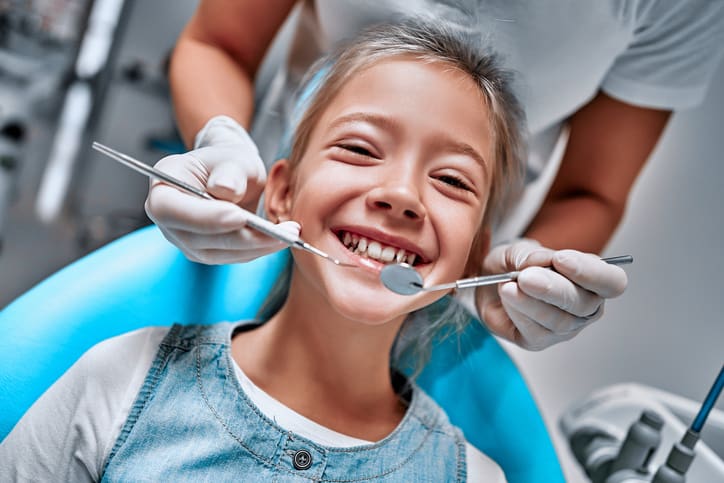 girl smiling in the dental chair